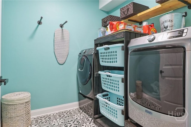 18 Sagefield Dr, Ellabell, GA 31308 - laundry room featuring independent washer and dryer and tile patterned flooring