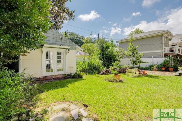 215 E 45th St, Savannah, GA 31405 - view of grassy yard featuring an outdoor structure