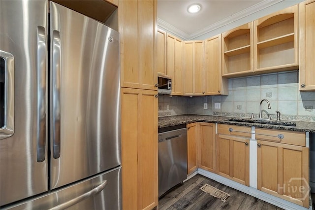 215 E 45th St, Savannah, GA 31405 - kitchen with stainless steel appliances, light brown cabinets, dark stone countertops, dark wood-type flooring, and crown molding