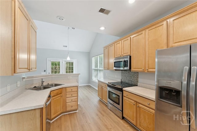 146 Royal Ln, Pooler, GA 31322 - kitchen featuring appliances with stainless steel finishes, light wood-type flooring, lofted ceiling, light brown cabinets, and recessed lighting