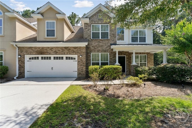 146 Royal Ln, Pooler, GA 31322 - view of front of property featuring concrete driveway, brick siding, an attached garage, and stucco siding