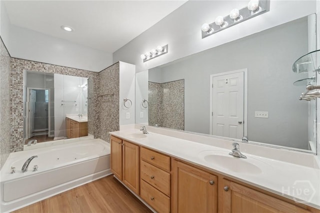 146 Royal Ln, Pooler, GA 31322 - full bath with a jetted tub, double vanity, wood finished floors, and a tile shower
