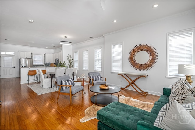 316 E 31st St, Savannah, GA 31401 - living area featuring wood-type flooring, recessed lighting, and ornamental molding