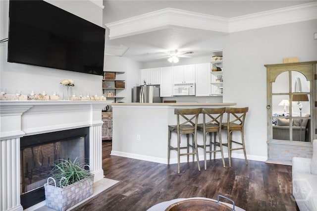 1212 Whitemarsh Way, Savannah, GA 31410 - living area featuring a ceiling fan, ornamental molding, and dark wood-style floors