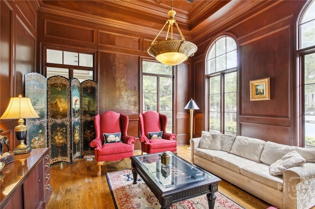 1212 Whitemarsh Way, Savannah, GA 31410 - living room featuring crown molding, healthy amount of natural light, a decorative wall, wood-type flooring, and wood ceiling