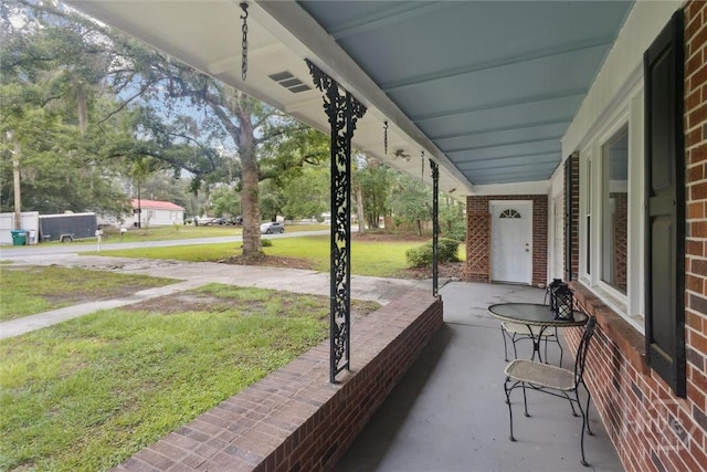 406 E 3rd St, Springfield, GA 31329 - porch featuring a lawn