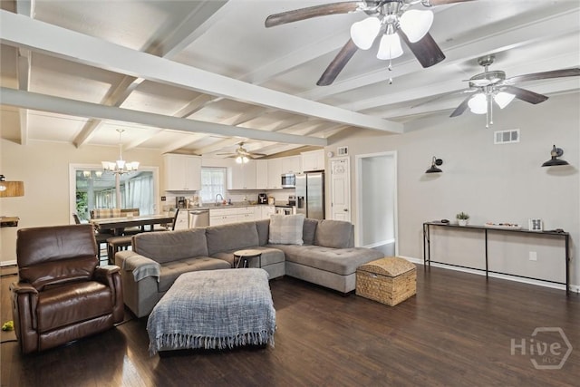 406 E 3rd St, Springfield, GA 31329 - living area featuring a ceiling fan, dark wood-style floors, and a chandelier