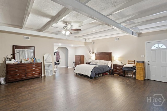 406 E 3rd St, Springfield, GA 31329 - bedroom with wood finished floors, arched walkways, beamed ceiling, a textured ceiling, and a ceiling fan