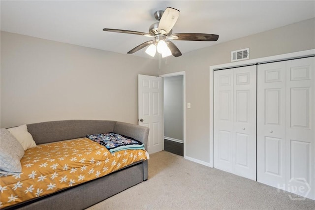 406 E 3rd St, Springfield, GA 31329 - bedroom with carpet flooring, a closet, and a ceiling fan