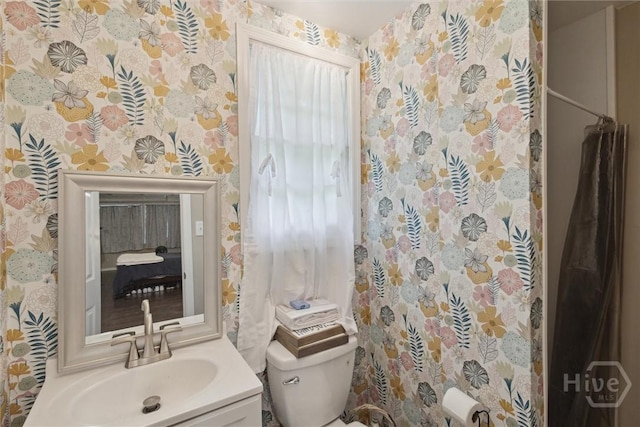 406 E 3rd St, Springfield, GA 31329 - bathroom featuring wallpapered walls and vanity