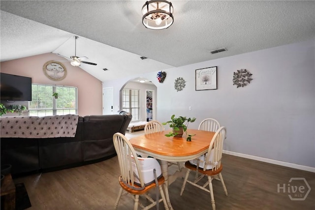 316 Clairemore Cir, Hinesville, GA 31313 - dining room with a ceiling fan, wood finished floors, a textured ceiling, arched walkways, and vaulted ceiling