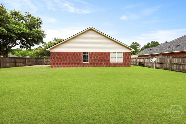 316 Clairemore Cir, Hinesville, GA 31313 - back of house featuring a fenced backyard and brick siding