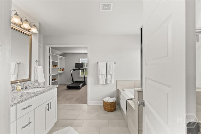 104 Finch Ln, Guyton, GA 31312 - bathroom with vanity, a bath, and tile patterned floors