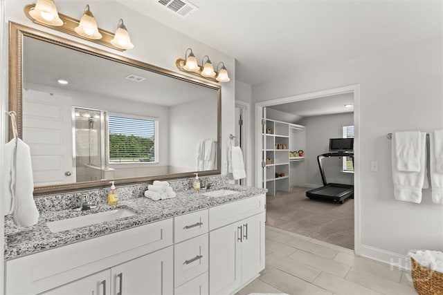 104 Finch Ln, Guyton, GA 31312 - bathroom with double vanity, a stall shower, and tile patterned floors