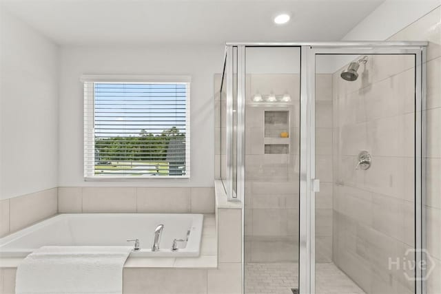 104 Finch Ln, Guyton, GA 31312 - bathroom featuring a shower stall, a garden tub, and recessed lighting