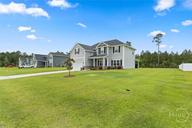 104 Finch Ln, Guyton, GA 31312 - view of front facade featuring a garage and driveway