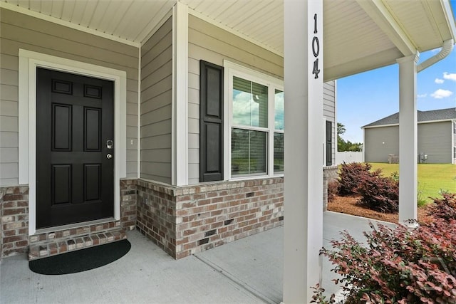 104 Finch Ln, Guyton, GA 31312 - doorway to property with covered porch