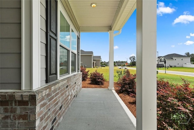 104 Finch Ln, Guyton, GA 31312 - covered porch featuring a residential view