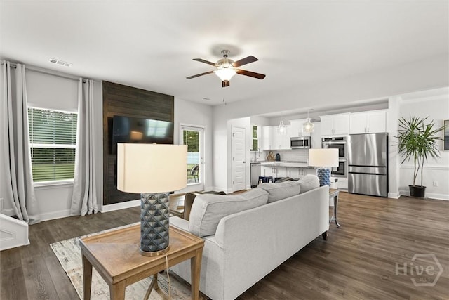 104 Finch Ln, Guyton, GA 31312 - living area with a ceiling fan and dark wood-style floors