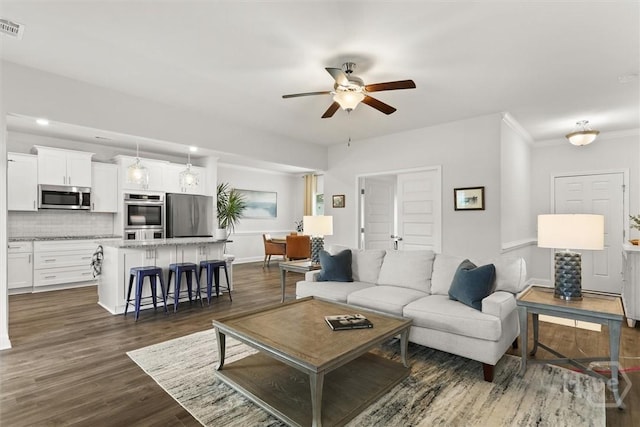 104 Finch Ln, Guyton, GA 31312 - living area with ceiling fan and dark wood-style floors