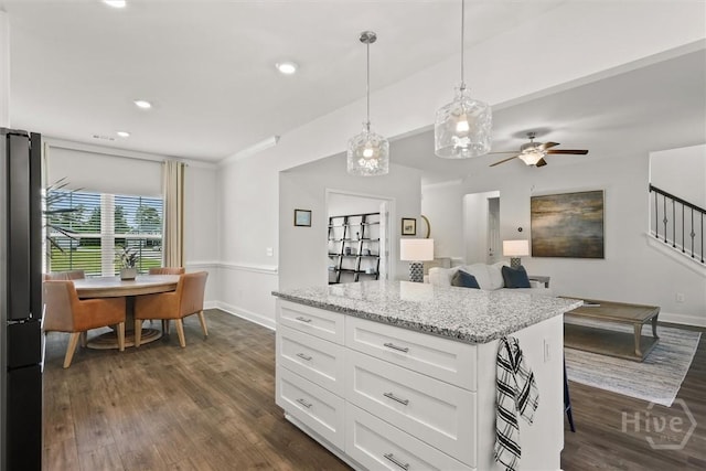 104 Finch Ln, Guyton, GA 31312 - kitchen featuring dark wood-type flooring, freestanding refrigerator, white cabinets, decorative light fixtures, and recessed lighting