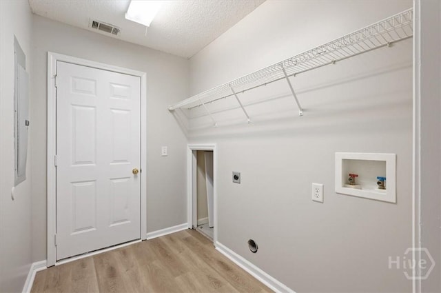 65 Golden Gate Dr, Pooler, GA 31322 - laundry area featuring electric dryer hookup, light wood-style floors, washer hookup, and a textured ceiling