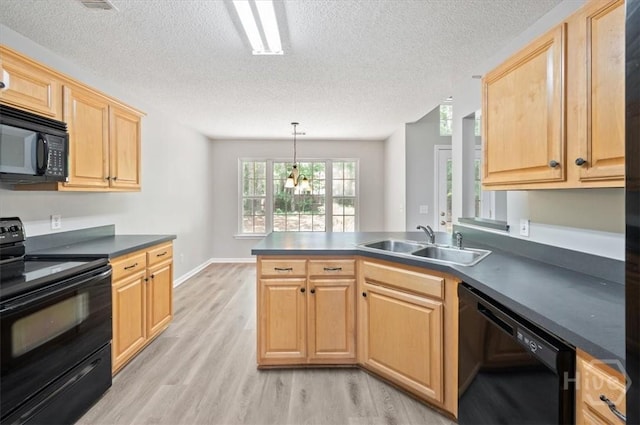 65 Golden Gate Dr, Pooler, GA 31322 - kitchen with black appliances, light wood-style floors, a peninsula, dark countertops, and light brown cabinetry