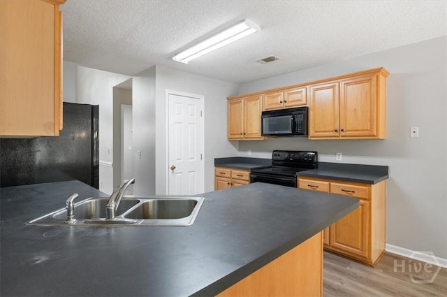 65 Golden Gate Dr, Pooler, GA 31322 - kitchen featuring black appliances, dark countertops, light wood finished floors, and a textured ceiling