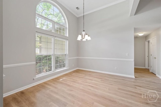 65 Golden Gate Dr, Pooler, GA 31322 - spare room with a chandelier, crown molding, light wood-type flooring, and a towering ceiling