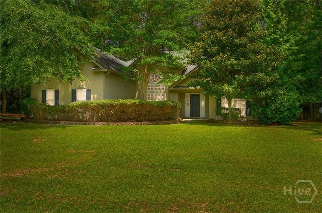 65 Golden Gate Dr, Pooler, GA 31322 - view of front facade featuring a front yard and stucco siding