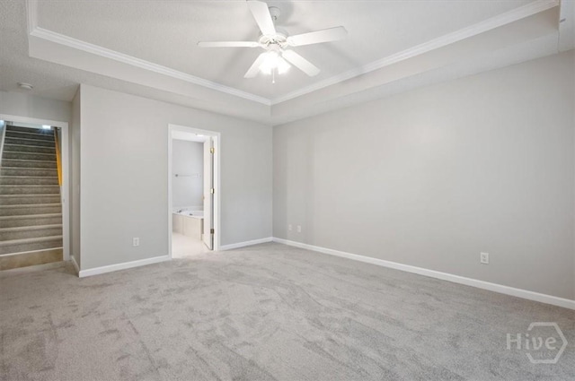 65 Golden Gate Dr, Pooler, GA 31322 - unfurnished bedroom featuring a raised ceiling, crown molding, carpet flooring, ensuite bathroom, and ceiling fan