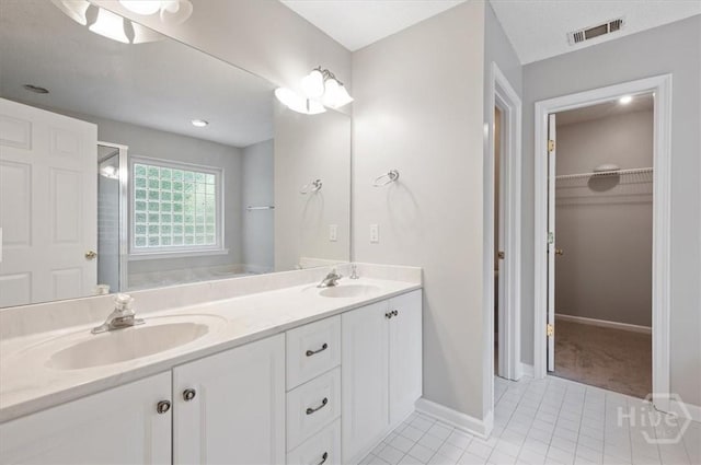 65 Golden Gate Dr, Pooler, GA 31322 - full bathroom featuring double vanity, tile patterned flooring, and a spacious closet