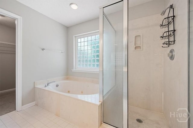 65 Golden Gate Dr, Pooler, GA 31322 - full bathroom with a tub with jets, a stall shower, tile patterned floors, and a spacious closet