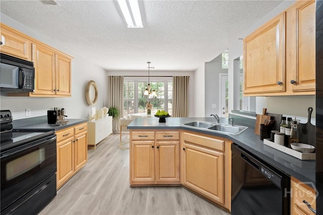 65 Golden Gate Dr, Pooler, GA 31322 - kitchen with black appliances, a peninsula, light wood-style floors, a textured ceiling, and light brown cabinets