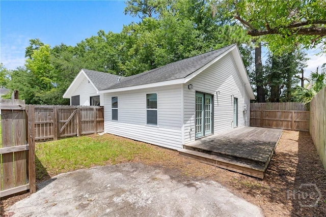 911 Hamilton Ct, Savannah, GA 31401 - back of house with a fenced backyard, a deck, a patio, and roof with shingles