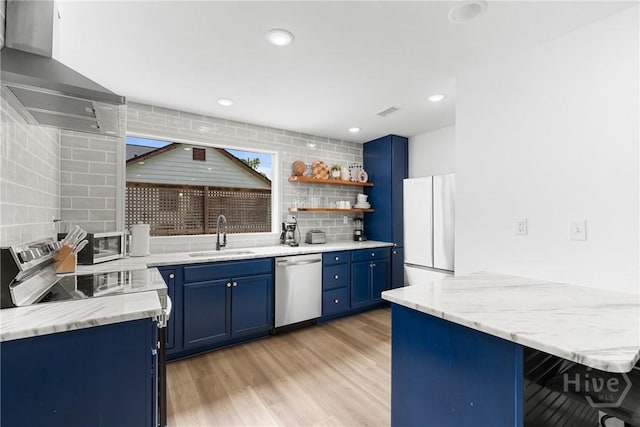 911 Hamilton Ct, Savannah, GA 31401 - kitchen with stainless steel appliances, blue cabinets, wall chimney exhaust hood, open shelves, and recessed lighting