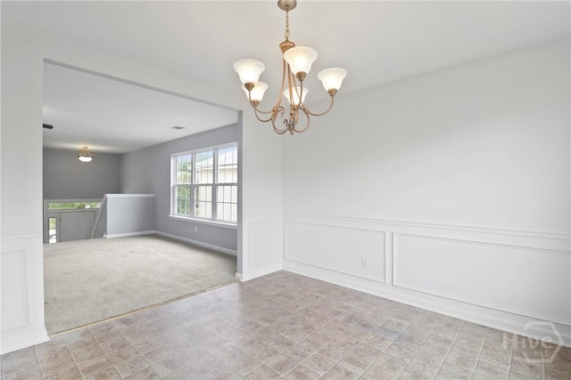 15 Springwater Dr, Port Wentworth, GA 31407 - carpeted spare room with a chandelier and baseboards