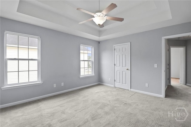 15 Springwater Dr, Port Wentworth, GA 31407 - unfurnished bedroom featuring a tray ceiling, carpet, and a ceiling fan
