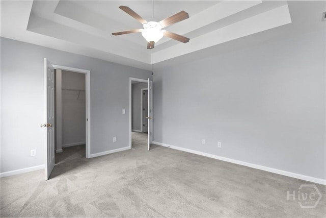 15 Springwater Dr, Port Wentworth, GA 31407 - unfurnished bedroom with a raised ceiling, carpet floors, a walk in closet, a closet, and ceiling fan
