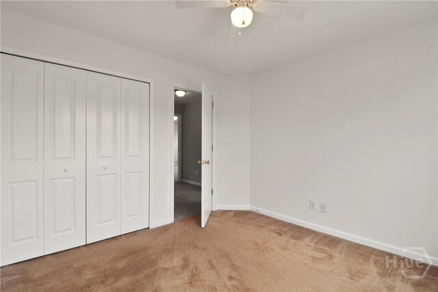 15 Springwater Dr, Port Wentworth, GA 31407 - unfurnished bedroom featuring light colored carpet, a closet, and a ceiling fan