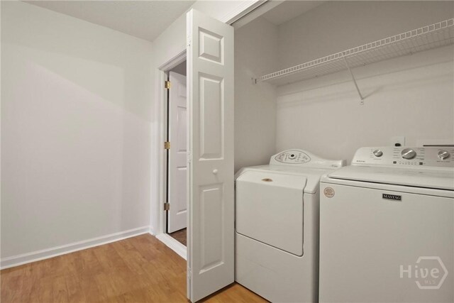 15 Springwater Dr, Port Wentworth, GA 31407 - laundry room featuring washing machine and clothes dryer and light wood-type flooring