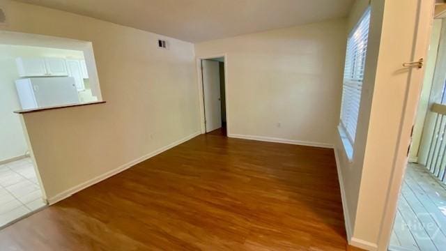 401 N Cromwell Rd Unit G1, Savannah, GA 31410 - empty room featuring wood finished floors and plenty of natural light