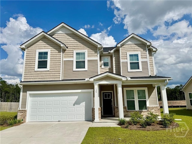 135 Melody Dr, Pooler, GA 31322 - craftsman-style house featuring a garage, driveway, brick siding, and a porch