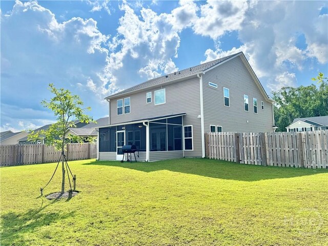 135 Melody Dr, Pooler, GA 31322 - back of property featuring a sunroom and a fenced backyard