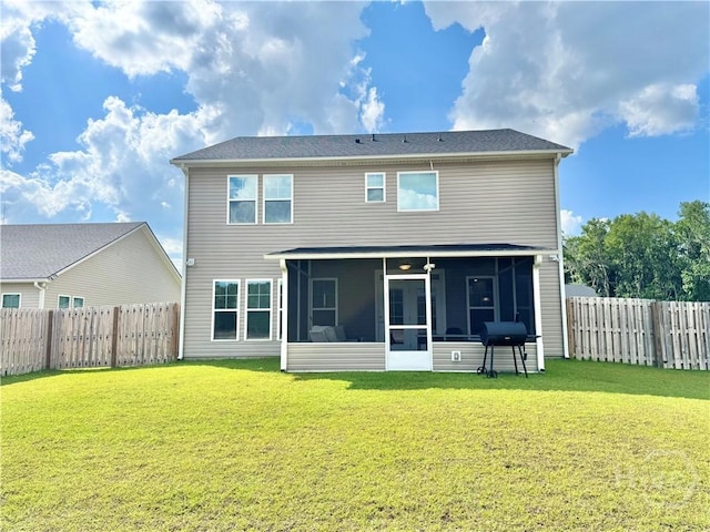 135 Melody Dr, Pooler, GA 31322 - rear view of property featuring a sunroom and a fenced backyard