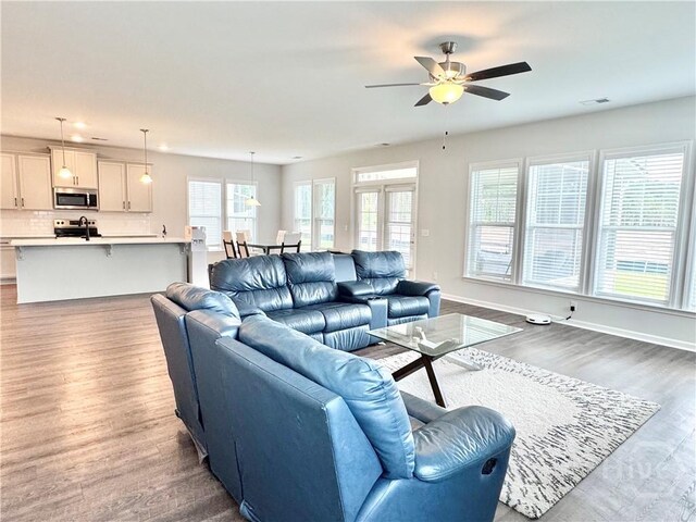 135 Melody Dr, Pooler, GA 31322 - living area featuring ceiling fan, wood finished floors, and recessed lighting