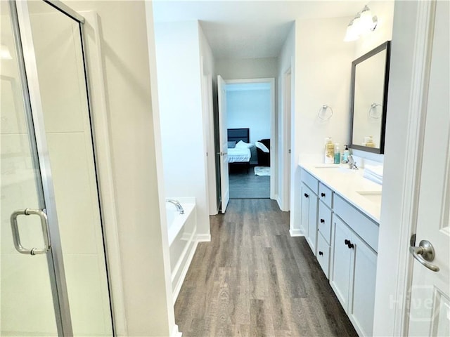135 Melody Dr, Pooler, GA 31322 - ensuite bathroom with wood finished floors, double vanity, a stall shower, and a garden tub