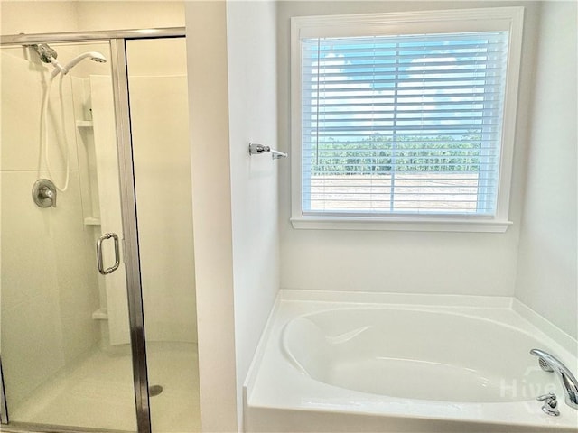 135 Melody Dr, Pooler, GA 31322 - bathroom featuring plenty of natural light, a bath, and a shower stall