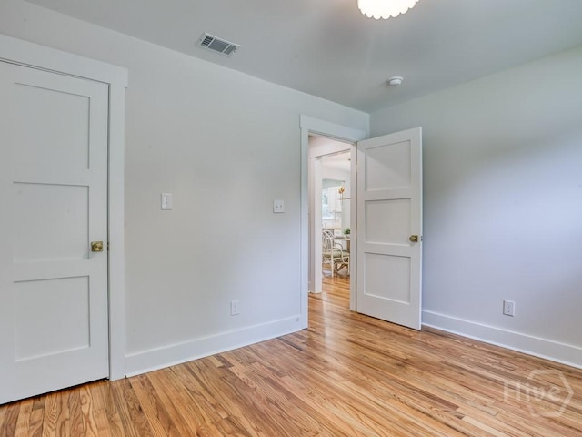 2409 E 37th St, Savannah, GA 31404 - empty room featuring light wood-style floors and a smoke detector