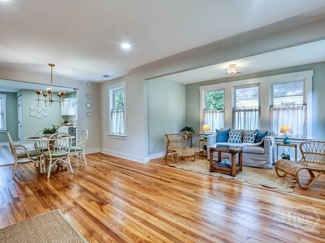 2409 E 37th St, Savannah, GA 31404 - living area with a chandelier and light wood-style floors